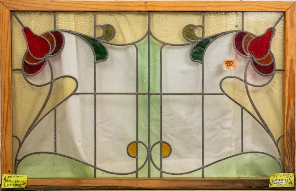 ENGLISH ART NOUVEAU STAINED GLASS PANEL: English Art Nouveau stained glass panel with floral details at the corners. Approximate dimensions: h. 28", w. 43" Disclaimer: This is an online court ordered bankruptcy sale. Participating bidders mu