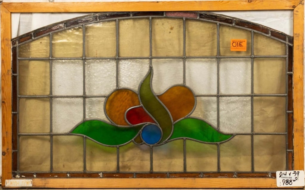 FRENCH ART NOUVEAU DOME TOP STAINED GLASS PANEL: French Art Nouveau dome-top stained glass panel with a floral medallion. Approximate dimensions: h. 24", w. 39" Disclaimer: This is an online court ordered bankruptcy sale. Participating bidders must