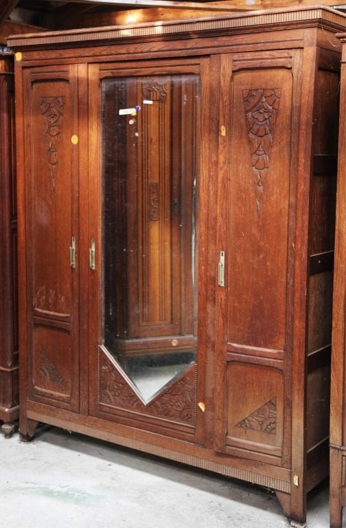 FRENCH ART NOUVEAU MIRRORED ARMOIRE: French Art Nouveau mirrored armoire with a beveled mirror, intricately carved floral panels, and beadwork accents. Approximate dimensions: h. 83.5", w. 68", d. 25" Disclaimer: This is an online court