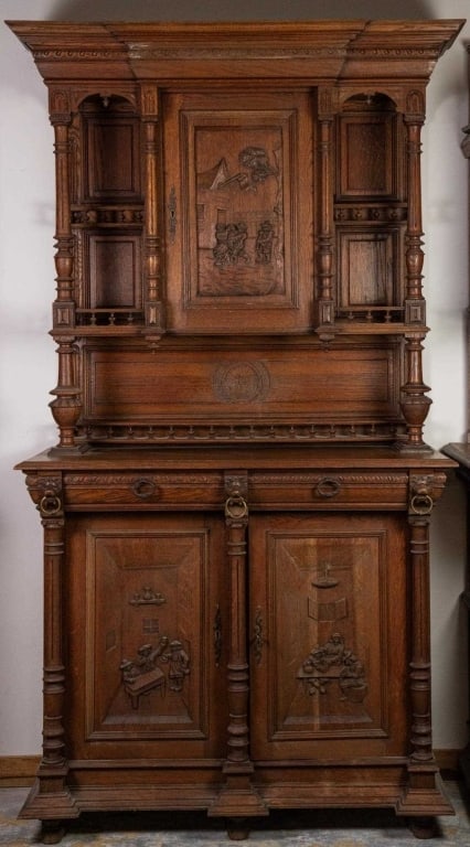 FRENCH RENAISSANCE REVIVAL CARVED BUFFET: French Renaissance Revival carved buffet with carved genre scenes, lion and brass ring accents, and carved galleries. Approximate dimensions: h. 90", w. 51", d. 22.5" Disclaimer: This is an online cou