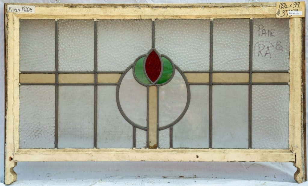 FRENCH ART NOUVEAU STAINED GLASS PANEL: French Art Nouveau stained glass panel with green and red central flower medallion. Approximate dimensions: h. 18.5", w. 39" Disclaimer: This is an online court ordered bankruptcy sale. Participating