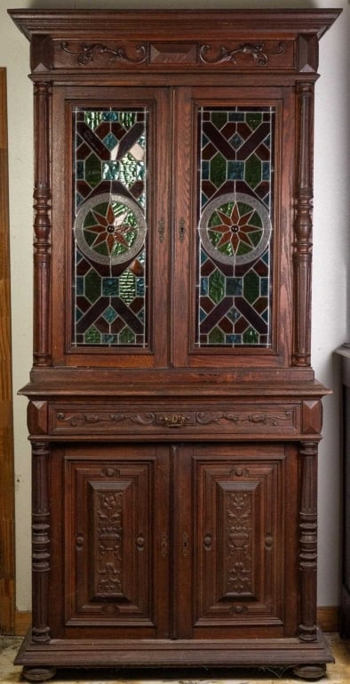 FRENCH RENAISSANCE REVIVAL STAINED GLASS BUFFET: French Renaissance Revival stained glass buffet with bun feet, and elaborately carved details. Approximate dimensions: h. 88", w. 43", d. 20" Disclaimer: This is an online court ordered bankruptcy sal