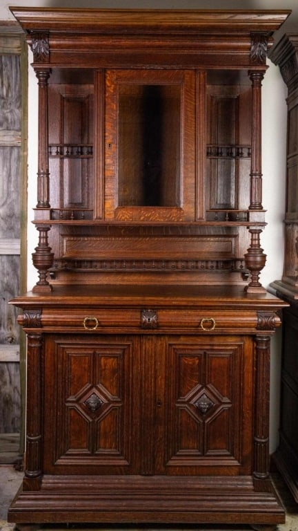 FRENCH RENAISSANCE REVIVAL VINTRINE BUFFET: French Renaissance Revival vitrine buffet with beveled mirror, carved galleries, and figural carved accents. Approximate dimensions: h. 90.5", w. 48", d. 23.5" Disclaimer: This is an online court orde