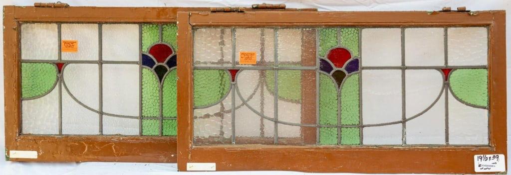 PAIR OF FRENCH ART NOUVEAU STAINED GLASS PANELS: Pair of French Art Nouveau stained glass panels with textured green stained glass accents. Approximate dimensions: h. 19.5", w. 39" Disclaimer: This is an online court ordered bankruptcy sale. Partici