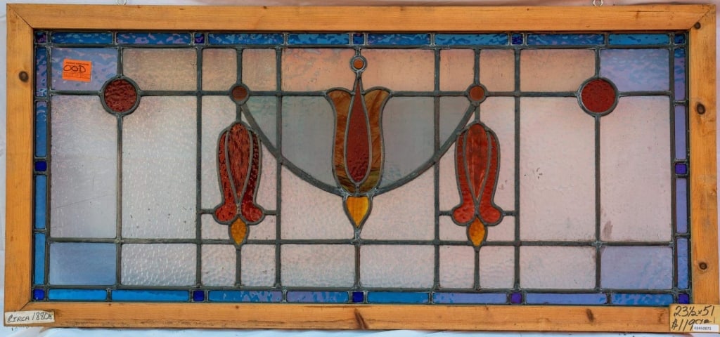 FRENCH ART NOUVEAU STAINED GLASS PANEL: French Art Nouveau stained glass panel with a floral motif and opalescent glass details. Approximate dimensions: h. 23.5", w. 51" Disclaimer: This is an online court ordered bankruptcy sale. Participa