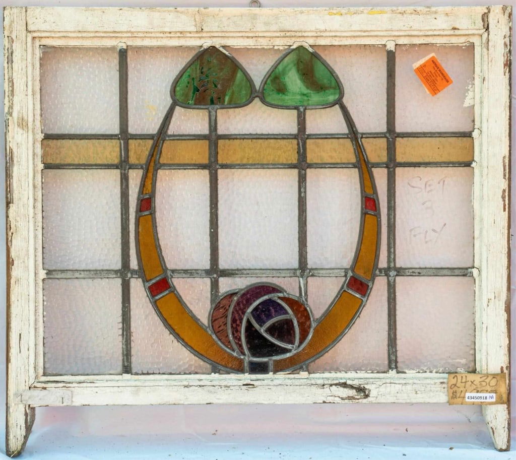 FRENCH ART NOUVEAU STAINED GLASS PANEL: French Art Nouveau stained glass panel with a floral motif, and green opalescent stained glass. Approximate dimensions: h. 24", w. 30" Disclaimer: This is an online court ordered bankruptcy sale. Part