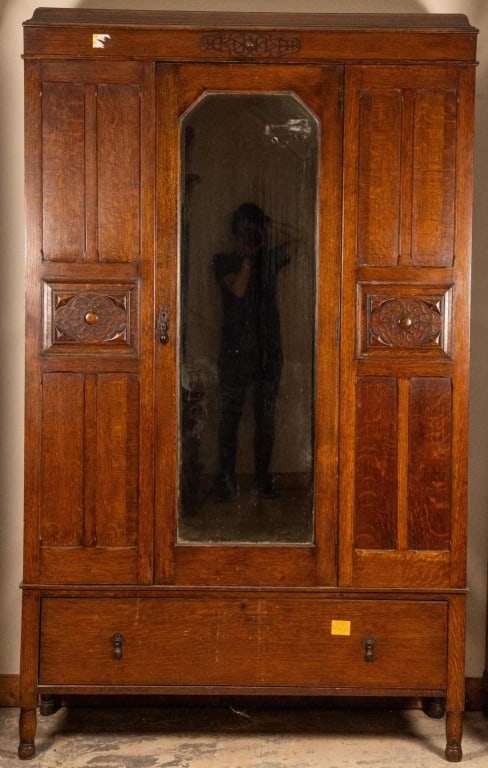 FRENCH ART NOUVEAU OAK ARMOIRE: French Art Nouveau oak armoire with beveled glass center door. Approximate dimensions: h. 79", w. 48", d. 18" Disclaimer: This is an online court ordered bankruptcy sale. Participating bidders must ha