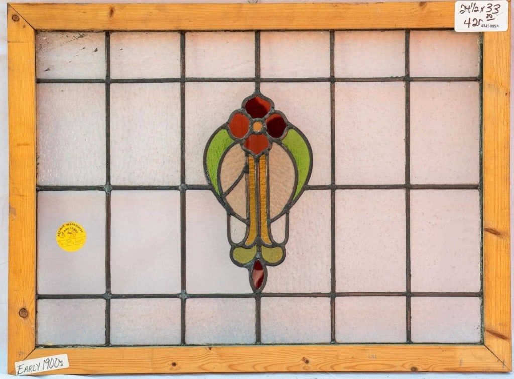 FRENCH ART NOUVEAU STAINED GLASS PANEL: French Art Nouveau stained glass panel with a red floral motif in stained glass, set within colorless leaded glass panels. Approximate dimensions: h. 24.5", w. 33" Disclaimer: This is an online court