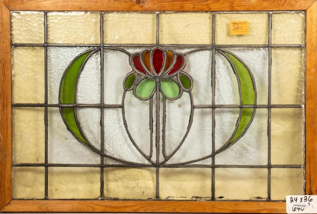 FRENCH ART NOUVEAU STAINED GLASS PANEL: French Art Nouveau stained glass panel with a heart-shaped floral medallion and leaf accents. Approximate dimensions: h. 24", w. 36" Disclaimer: This is an online court ordered bankruptcy sale. Partic