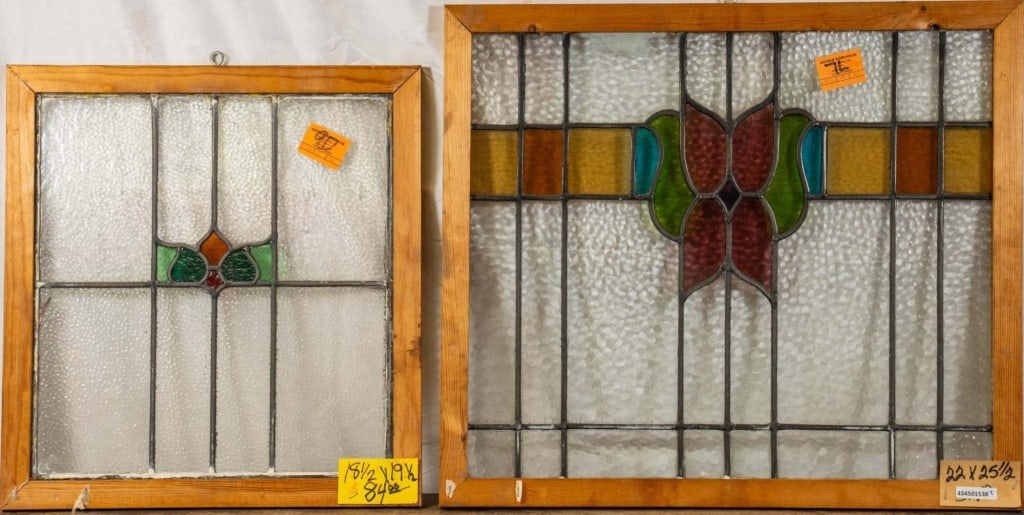 TWO CONTINENTAL STAINED GLASS PANELS: Two Continental stained glass panels with a floral motif. Approximate dimensions: h. 22", w. 25.5" Disclaimer: This is an online court ordered bankruptcy sale. Participating bidders must have a credit