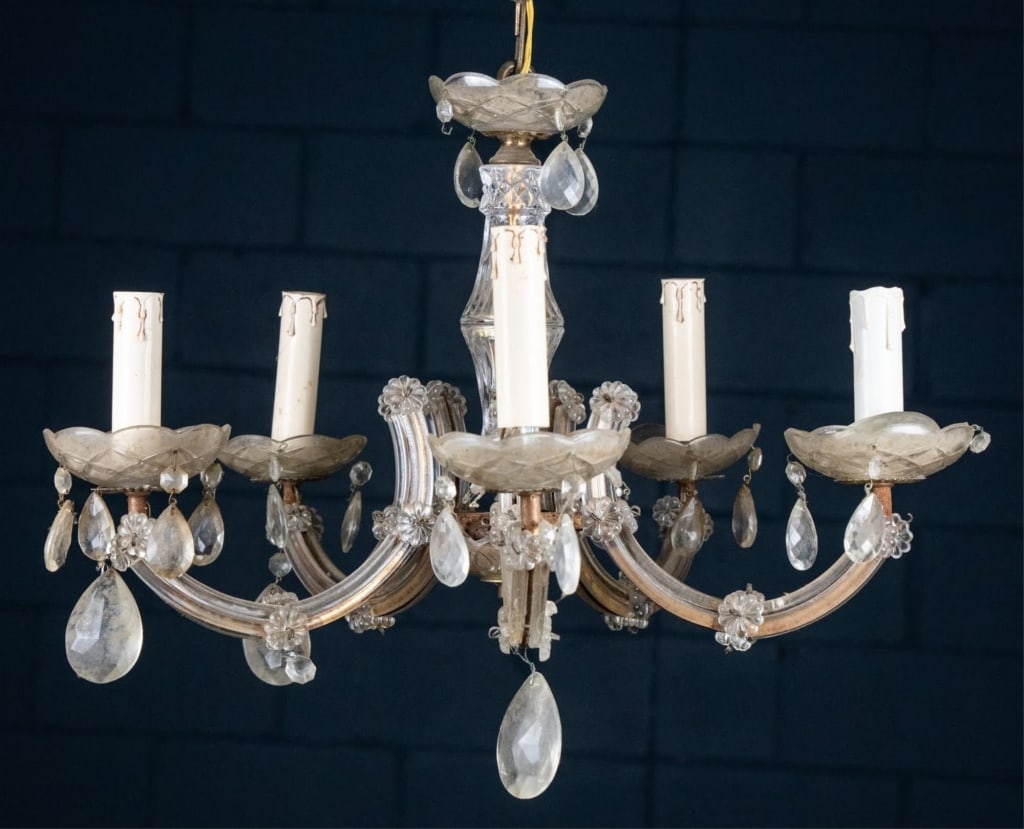 VENETIAN STYLE 5-LIGHT CHANDELIER: Venetian style 5-light chandelier with colorless faceted prisms and swags, and crystal floral accents. Approximate dimensions: h. 15.5", w. 20" Disclaimer: This is an online court ordered bankruptcy s