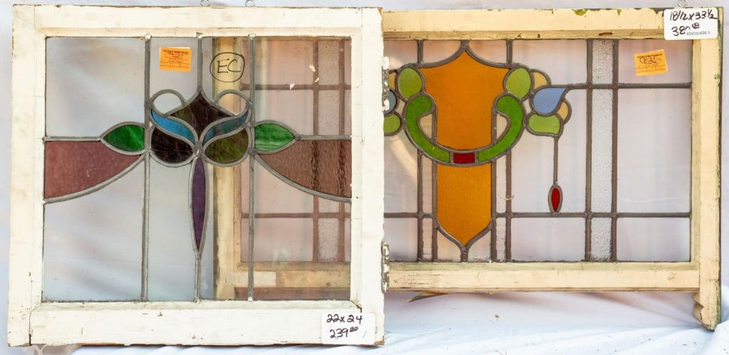 TWO FRENCH ART NOUVEAU STAINED GLASS PANELS: Two French Art Nouveau stained glass panels with a floral motif. Approximate dimensions: h. 18.5", w. 33.5" Disclaimer: This is an online court ordered bankruptcy sale. Participating bidders must have