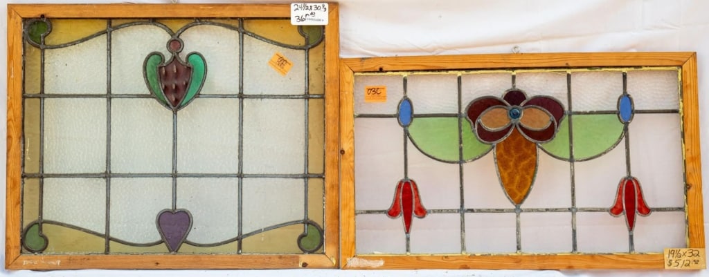 TWO FRENCH ART NOUVEAU STAINED GLASS PANELS: Two French Art Nouveau stained glass panels with floral and heart medallions, one with blue jeweled detail. Approximate dimensions: h. 19.5", w. 32" Disclaimer: This is an online court ordered bankrup