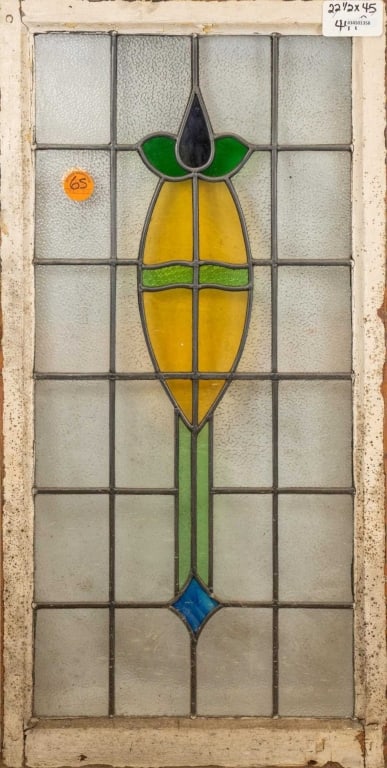 FRENCH ART NOUVEAU STAINED GLASS PANEL: French Art Nouveau stained glass panel with a floral medallion and a blue wispy glass rhombic accent. Approximate dimensions: h. 45", w. 22.5" Disclaimer: This is an online court ordered bankruptcy sa