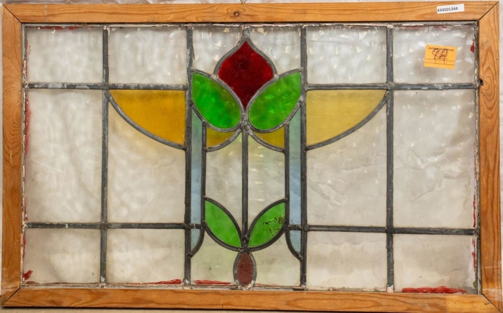 CONTINENTAL STAINED GLASS PANEL: Continental stained glass panel with a floral motif. Approximate dimensions: h. 21", w. 33.5" Disclaimer: This is an online court ordered bankruptcy sale. Participating bidders must have a credit card