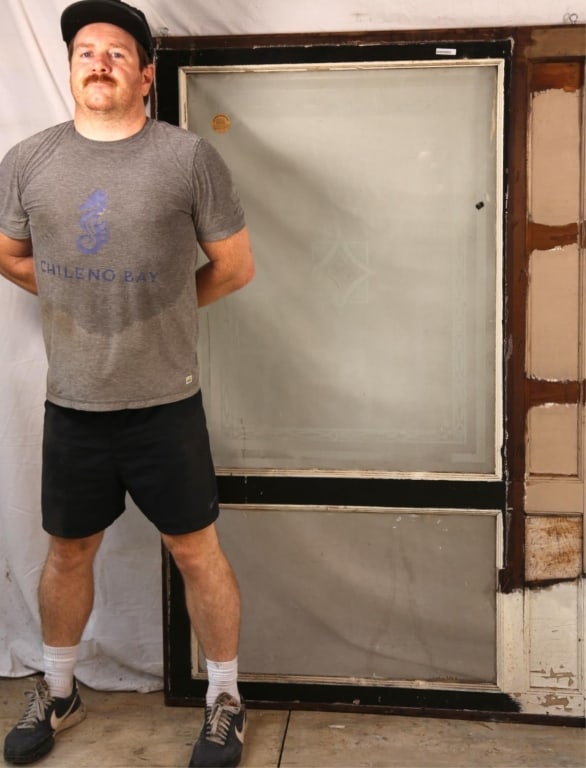 ANTIQUE ETCHED AND BEVELED GLASS WINDOW: Antique etched and beveled glass window with ornated central panel. Approximate dimensions: h. 64", w. 42.5" Disclaimer: This is an online court ordered bankruptcy sale. Participating bidders must hav