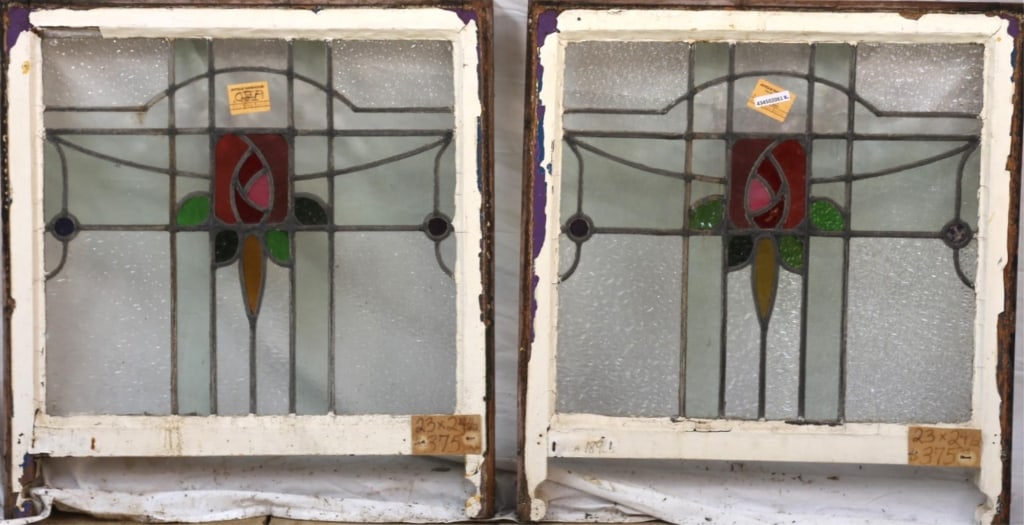 PAIR OF FRENCH STAINED GLASS PANELS: Pair of French stained glass panels with floral medallions, leaf details, and amber and blue accents. Approximate dimensions: h. 23", w. 24" Disclaimer: This is an online court ordered bankruptcy sale