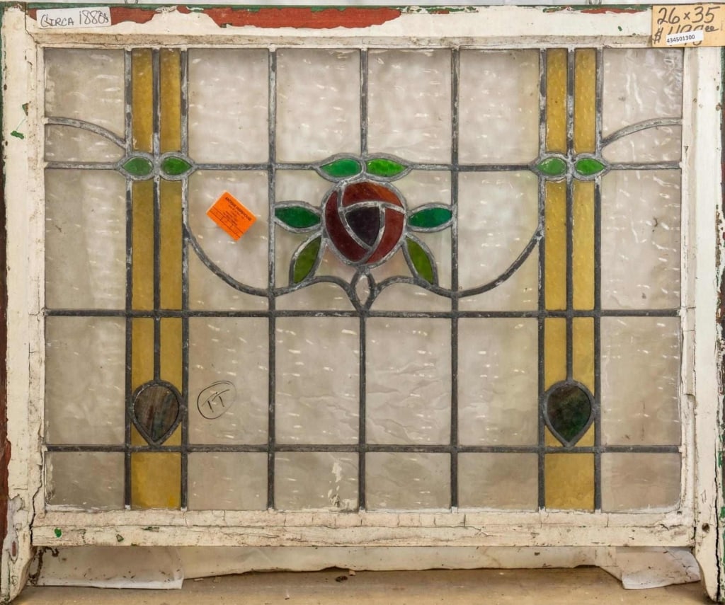 FRENCH ART NOUVEAU STAINED GLASS PANEL: French Art Nouveau stained glass panel with a rose medallion and wispy glass drop accents. Approximate dimensions: h. 26", w. 35" Disclaimer: This is an online court ordered bankruptcy sale. Participa