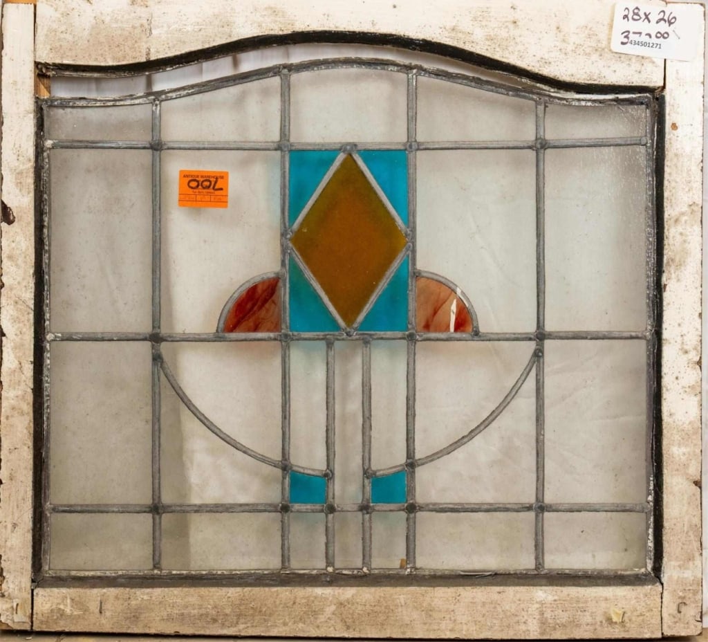 ANTIQUE CONTINENTAL STAINED GLASS PANEL: Antique Continental stained glass panel with wispy glass accents and a geometric medallion. Approximate dimensions: h. 26", w. 28" Disclaimer: This is an online court ordered bankruptcy sale. Particip