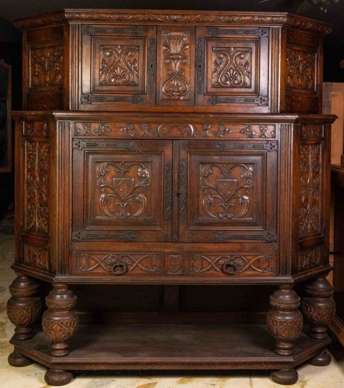 FRENCH RENAISSANCE REVIVAL RAISED COURT CUPBOARD: French Renaissance Revival raised court cupboard with bun feet and floral and shield-form carved details. Approximate dimensions: h. 71", w. 70", d. 21" Disclaimer: This is an online court ordered ban