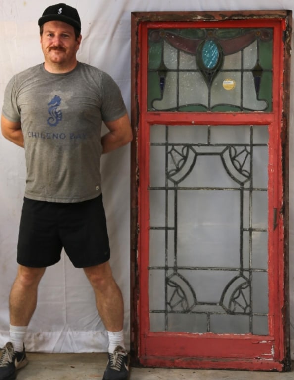 ANTIQUE FRENCH JEWELED STAINED GLASS PANEL: Antique French jeweled stained glass panel with amber jeweled detail and garland motif. Approximate dimensions: h. 65.5", w. 29" Disclaimer: This is an online court ordered bankruptcy sale. Participat