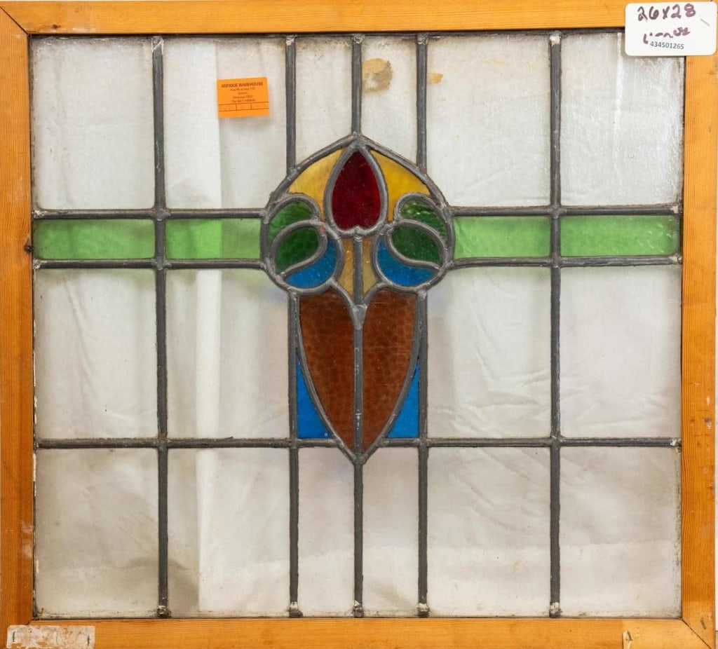 FRENCH ART NOUVEAU STAINED GLASS PANEL: French Art Nouveau stained glass panel with a floral medallion and green accent panels Approximate dimensions: h. 26", w. 28" Disclaimer: This is an online court ordered bankruptcy sale. Participating