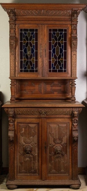 FRENCH RENAISSANCE REVIVAL STAINED GLASS BUFFET: French Renaissance Revival stained glass buffet with lion head and brass ring accents, bun feet, and elaborately carved details. Approximate dimensions: h. 88", w. 40", d. 21" Disclaimer: This is an o