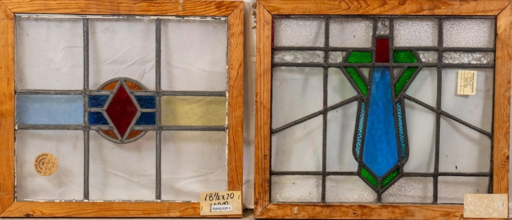 TWO CONTINENTAL STAINED GLASS PANELS: Two Continental stained glass panels, one with textured colorless leaded glass panels and the other with a geometric motif medallion. Approximate dimensions: h. 18.5", w. 20" Disclaimer: This is an on
