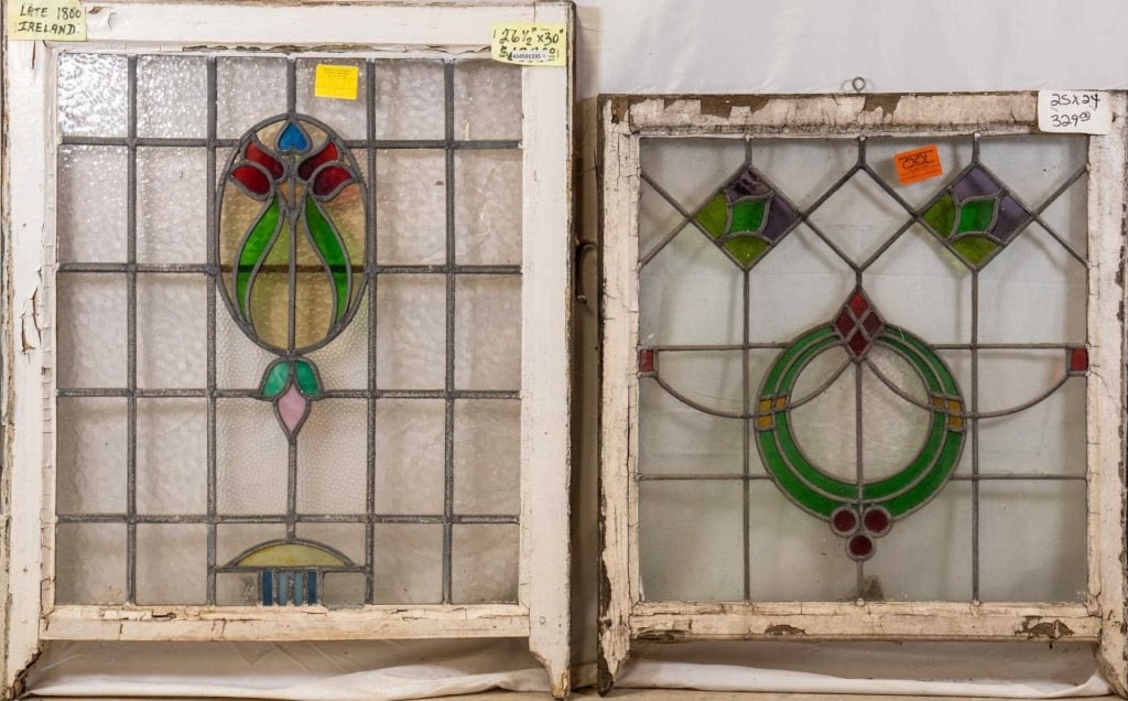 TWO FRENCH STAINED GLASS PANELS: Two French stained glass panels with floral and geometric motifs. Approximate dimensions: h. 26.5", w. 30" Disclaimer: This is an online court ordered bankruptcy sale. Participating bidders must have