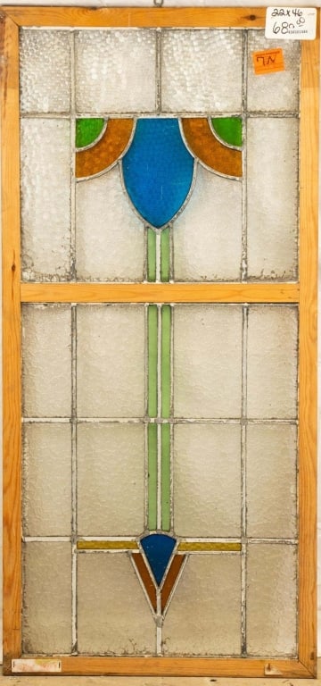CONTINENTAL STAINED GLASS PANEL: Continental stained glass panel with blue, amber, and green elements, some textured. Approximate dimensions: h. 46", w. 22" Disclaimer: This is an online court ordered bankruptcy sale. Participating b