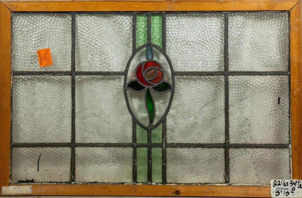 FRENCH ART NOUVEAU STAINED GLASS PANEL: French Art Nouveau stained glass panel with rose and leaf medallion and colorless leaded glass panels. Approximate dimensions: h. 22.5", w. 34.5" Disclaimer: This is an online court ordered bankruptcy
