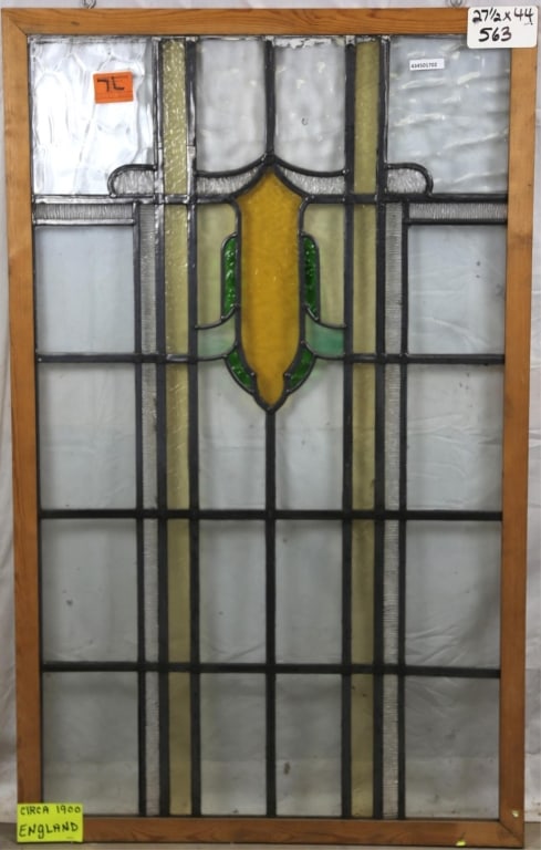 ANTIQUE ENGLISH STAINED GLASS PANEL: Antique English stained glass panel with a shield-form medallion. Approximate dimensions: h. 44", w. 27.5" Disclaimer: This is an online court ordered bankruptcy sale. Participating bidders must have
