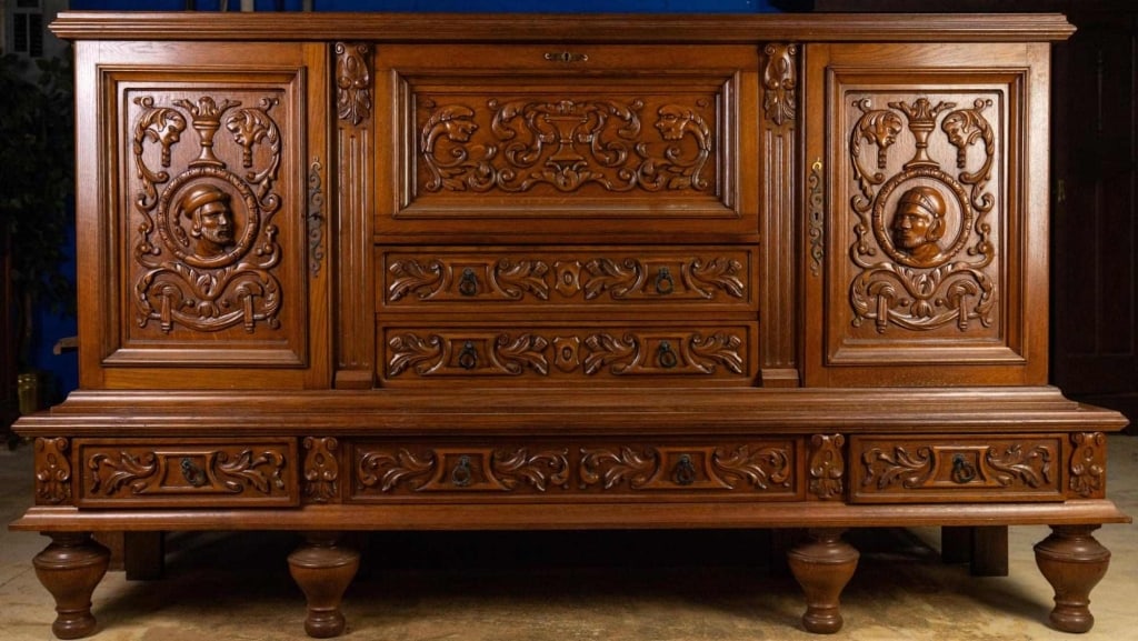 FRENCH RENAISSANCE REVIVAL ABATTANT CABINET: French Renaissance Revival abattant cabinet with inset carved panels and carved figural elements. Approximate dimensions: h. 53", w. 94", d. 21.75" Disclaimer: This is an online court ordered bankrupt