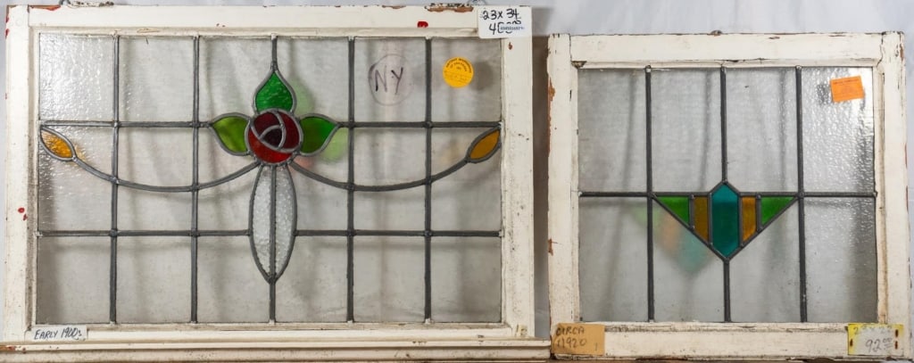 TWO ANTIQUE FRENCH STAINED GLASS PANELS: Two antique French stained glass panels, one with floral rose and leaf medallion, the other with geometric Art Deco medallion. Approximate dimensions: h. 23", w. 34" Disclaimer: This is an online cour