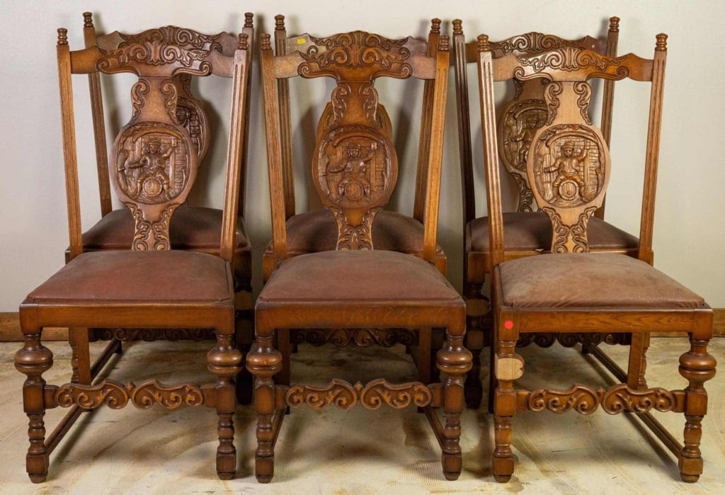 SET OF 6 FRENCH RENAISSANCE STYLE OAK CHAIRS: Set of 6 French Renaissance style oak chairs with figural carved backs, carved legs, and leather seats. Approximate dimensions: h. 41", w. 21", d. 20" Disclaimer: This is an online court ordered bankr