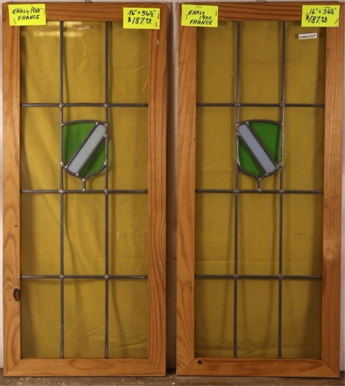 TWO ANTIQUE FRENCH STAINED GLASS PANELS: Two antique French stained glass panels with shield-form medallions. Approximate dimensions: h. 36.5", w. 16" Disclaimer: This is an online court ordered bankruptcy sale. Participating bidders must ha