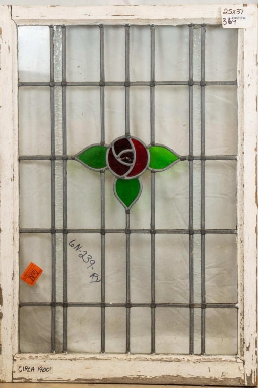 FRENCH ART NOUVEAU STAINED GLASS PANEL: French Art Nouveau stained glass panel with a rose and leaf medallion and colorless leaded glass panels. Approximate dimensions: h. 37", w. 25" Disclaimer: This is an online court ordered bankruptcy s