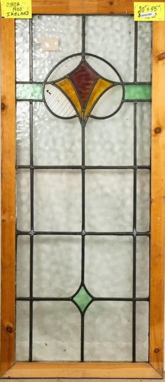 IRISH ART DECO STAINED GLASS PANEL: Irish Art Deco stained glass panel. Approximate dimensions: h. 45", w. 20" Disclaimer: This is an online court ordered bankruptcy sale. Participating bidders must have a credit card on file with Live