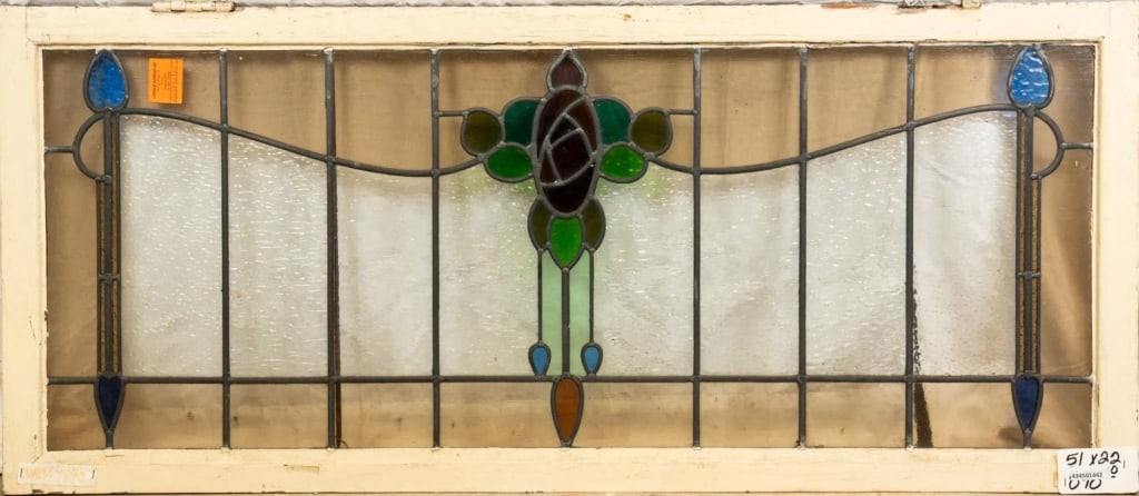 FRENCH ART NOUVEAU STAINED GLASS PANEL: French Art Nouveau stained glass panel with a floral medallion and blue textured drop-shaped accents. Approximate dimensions: h. 22", w. 51" Disclaimer: This is an online court ordered bankruptcy sale