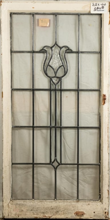 FRENCH ART NOUVEAU LEADED GLASS PANEL: French Art Nouveau leaded glass panel with tulip-shaped medallion, and colorless textured leaded glass panels. Approximate dimensions: h. 44", w. 22" Disclaimer: This is an online court ordered bankru