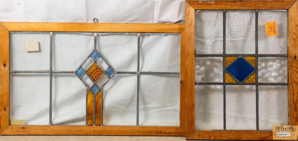 TWO CONTINENTAL STAINED GLASS PANELS: Two Continental stained glass panels with geometric medallions. Approximate dimensions: h. 16", w. 27" Disclaimer: This is an online court ordered bankruptcy sale. Participating bidders must have a cr