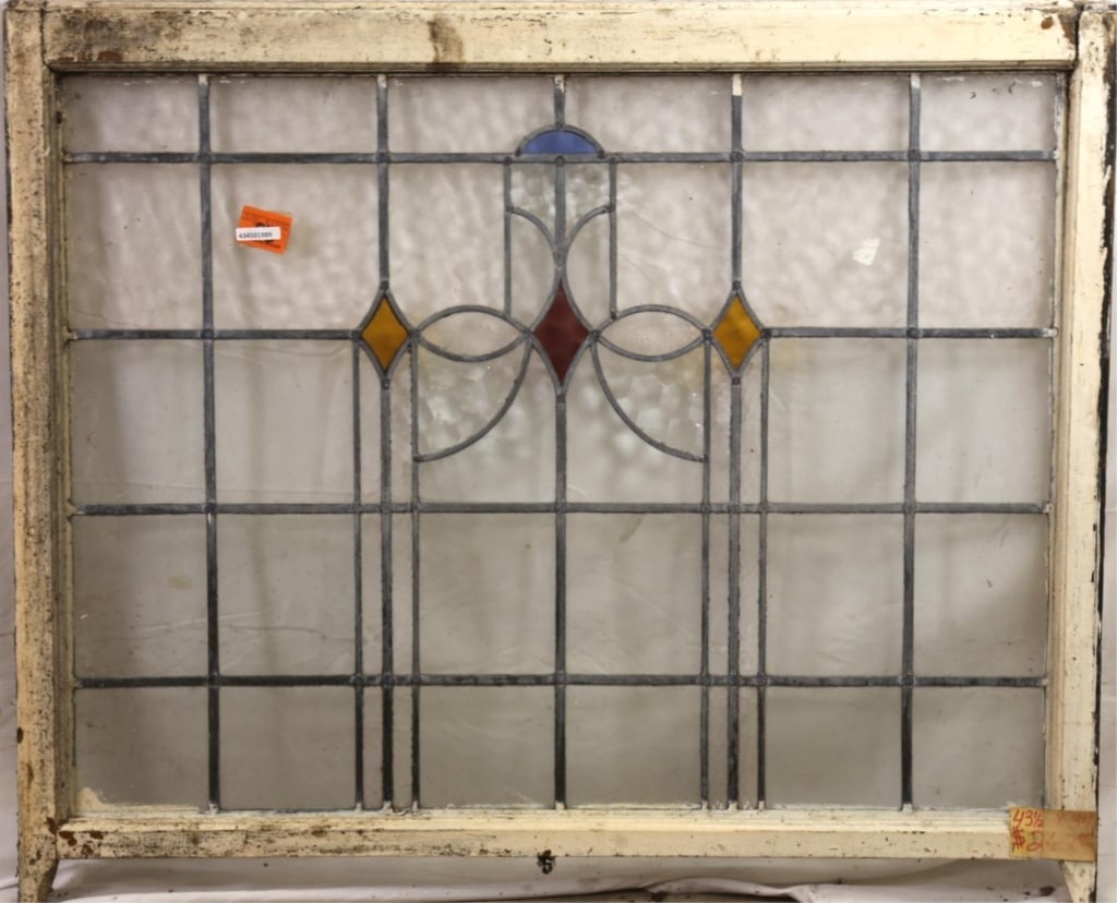ANTIQUE CONTINENTAL STAINED GLASS PANEL: Antique Continental stained glass panel with blue, yellow, and red stained glass accents. Approximate dimensions: h. 34", w. 44.5" Disclaimer: This is an online court ordered bankruptcy sale. Particip