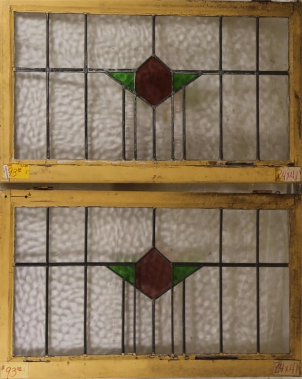 PAIR OF ART DECO STAINED GLASS WINDOWS: Pair of Art Deco stained glass windows with green and purple central geometric medallion. Approximate dimensions: h. 24", w. 41" Disclaimer: This is an online court ordered bankruptcy sale. Participat