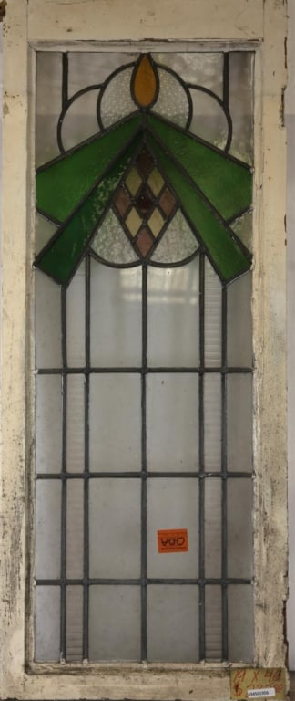 ENGLISH ART DECO STAINED GLASS PANEL: English Art Deco stained glass panel with a multicolored geometric medallion. Approximate dimensions: h. 46", w. 19" Disclaimer: This is an online court ordered bankruptcy sale. Participating bidders