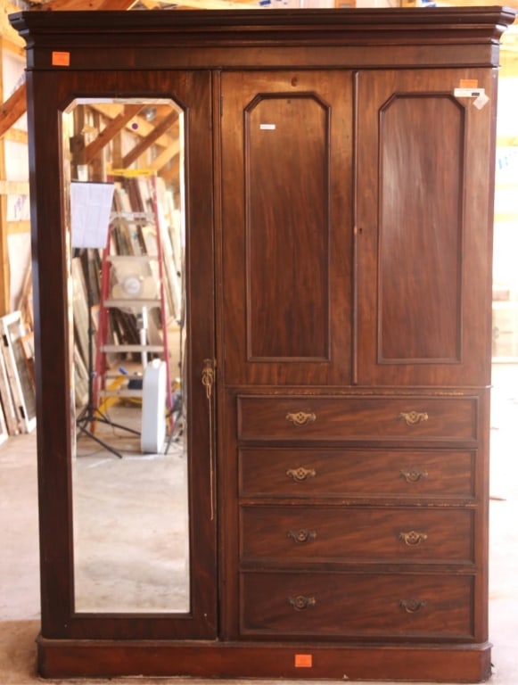 ENGLISH MAHOGANY SHIFFEROBE: English mahogany shifferobe with a beveled mirror and inset carved panels. Approximate dimensions: h. 81.75", w. 61", d. 22" Disclaimer: This is an online court ordered bankruptcy sale. Participating 