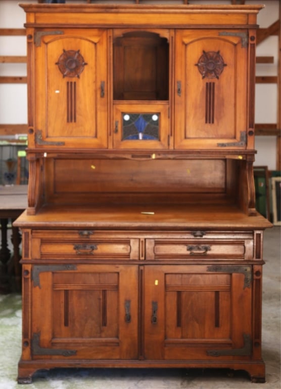 FRENCH ART NOUVEAU RAISED BUFFET: French Art Nouveau raised buffet with carved rosettes, a stained glass panel with wispy glass accents, and hand-forged hinges. Approximate dimensions: h. 84", w. 57", d. 27" Disclaimer: This is an onl