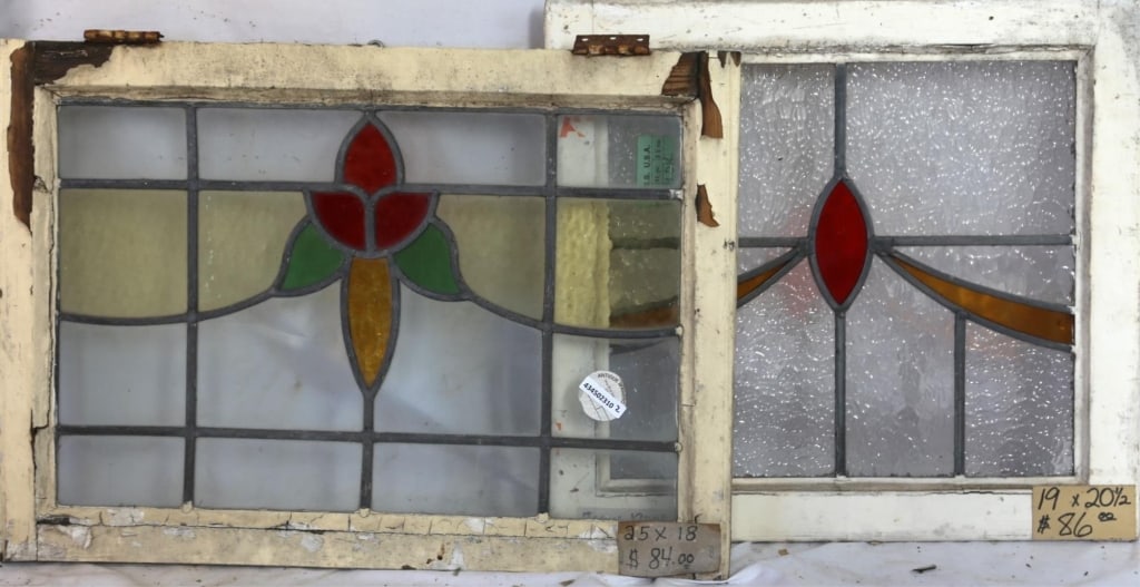 TWO CONTINENTAL STAINED GLASS PANELS: Two Continental stained glass panels with multicolored stained glass accents. Approximate dimensions: h. 18", w. 25" Disclaimer: This is an online court ordered bankruptcy sale. Participating bidders