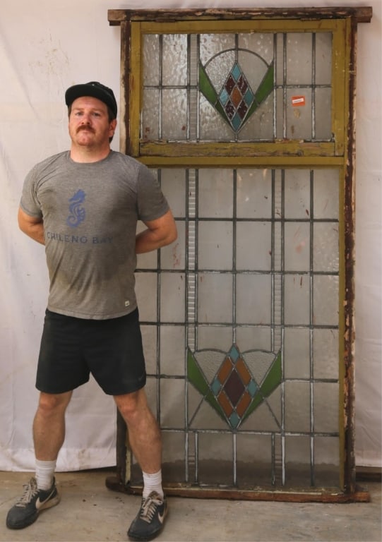 ENGLISH ART DECO STAINED GLASS PANEL: English Art Deco stained glass panel with rhombic medallions in red, amber, blue, and green. Approximate dimensions: h. 78", w. 39" Disclaimer: This is an online court ordered bankruptcy sale. Partici