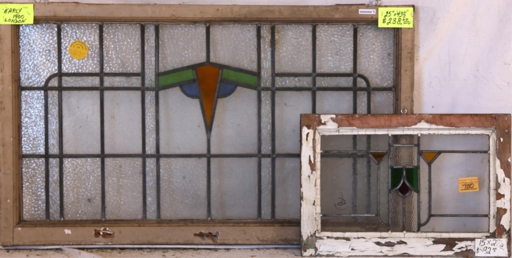 TWO ENGLISH STAINED GLASS PANELS: Two English stained glass panels with geometric medallions and multicolored stained glass details. Approximate dimensions: h. 25", w. 43.5" Disclaimer: This is an online court ordered bankruptcy sale.