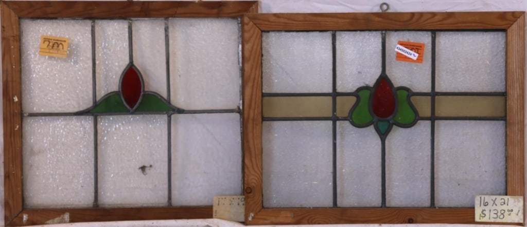 TWO CONTINENTAL STAINED GLASS PANELS: Two Continental stained glass panels with multicolored stained glass details. Approximate dimensions: h. 16", w. 21" Disclaimer: This is an online court ordered bankruptcy sale. Participating bidders
